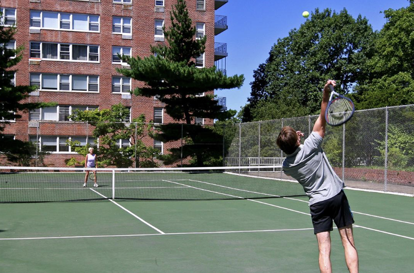 People playing tennis on court